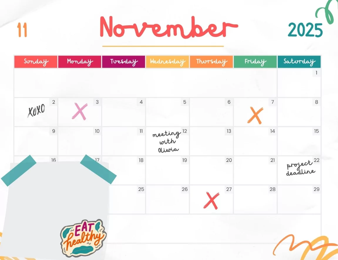 An editable November 2025 calendar being customized on a laptop for work planning.
